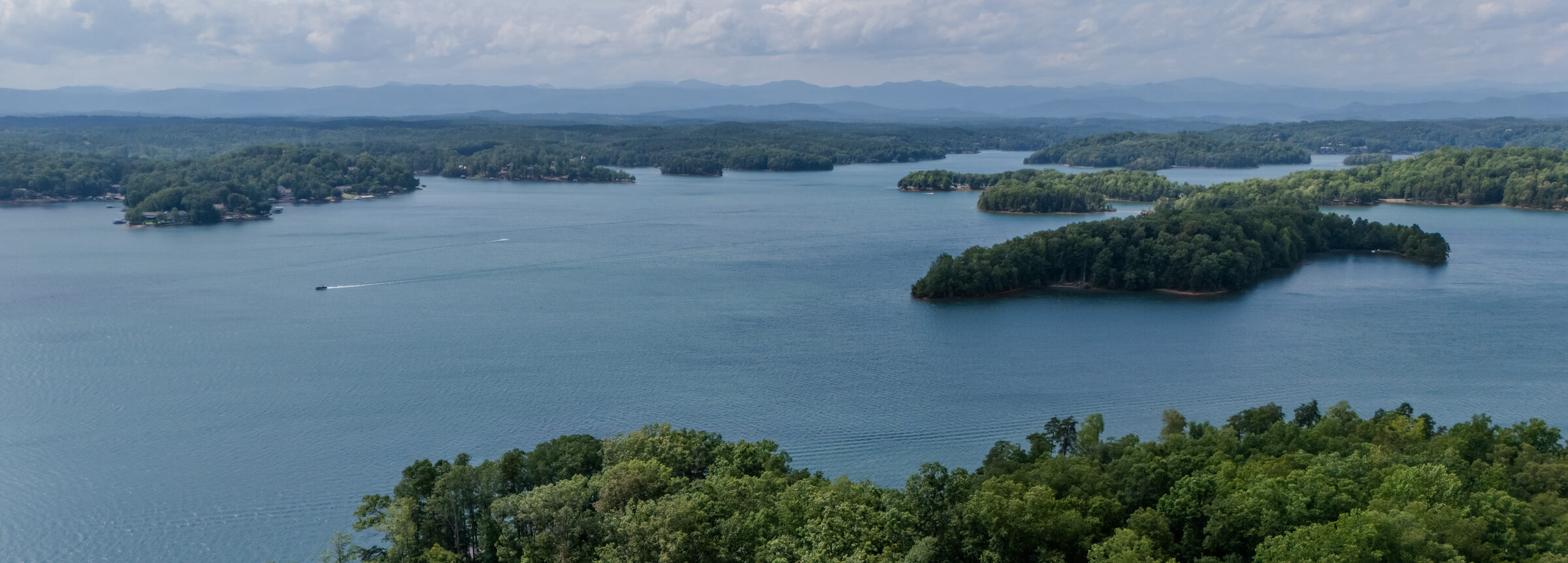 180-degree view from above the point across Lake Keowee to the Blue Ridge Mountains